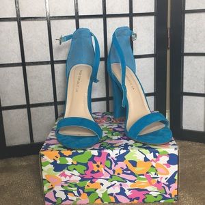 Turquoise strappy heels.